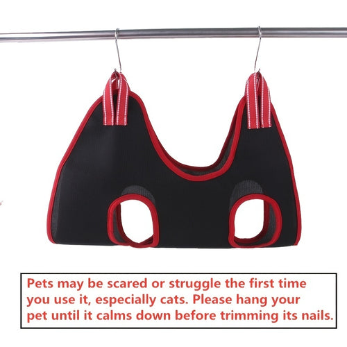 Pet grooming hammock hanging from a shower rod by two steel hooks